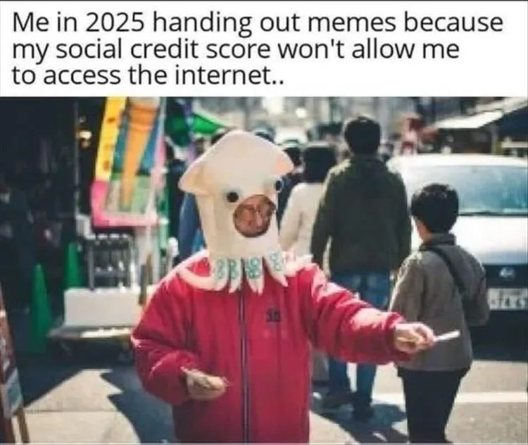 A person wearing a large, white, squid-like costume with a cartoonish face and a red jacket stands on a busy street…