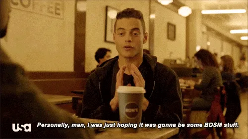 A man in a coffee shop holds a coffee cup and speaks while the overlaid text reads 'Personally, man, I was just hoping it…