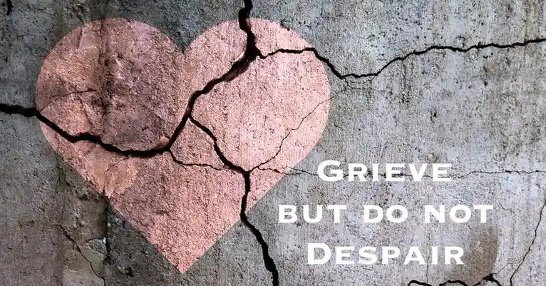 A cracked, heart-shaped outline drawn in reddish-brown on a weathered concrete wall with visible cracks. White text overlaid…