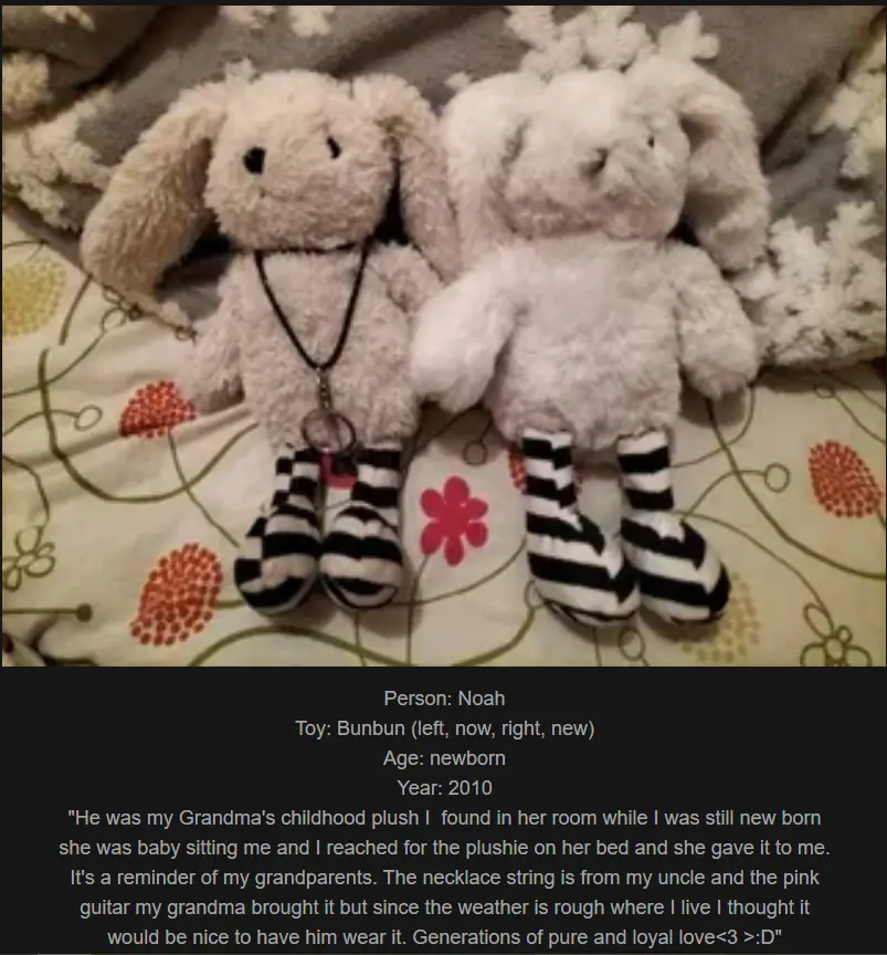 Two identical white stuffed bunny plush toys sit side-by-side on a floral-patterned bedspread, both wearing black-and-white…