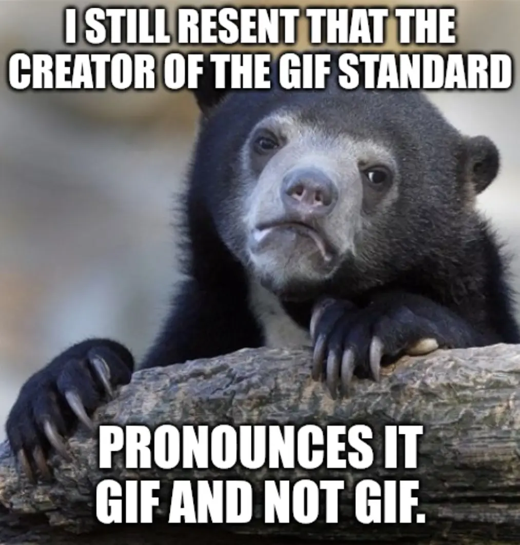 A close-up photo of a black bear with a grumpy, resentful expression, leaning on a log with its paws. The text overlaid in…