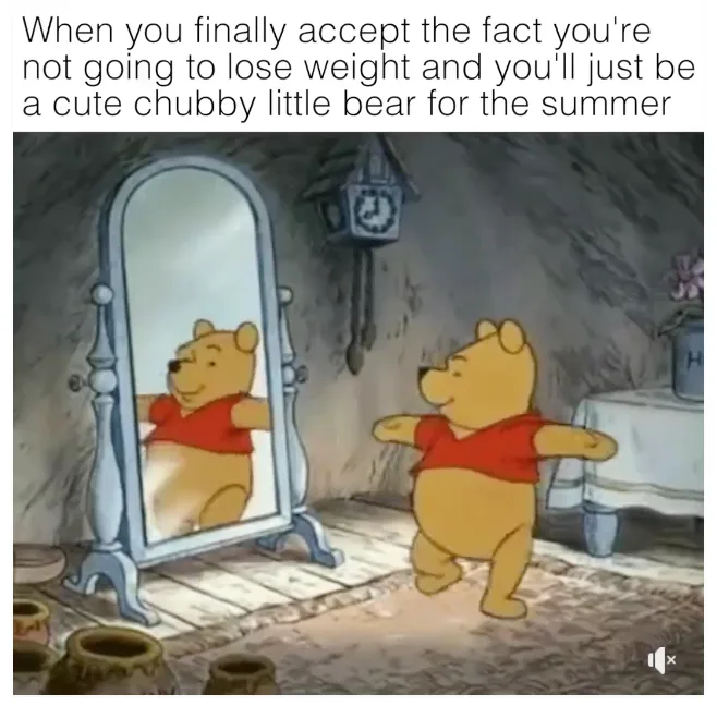 A cartoon image of Winnie the Pooh standing in front of a mirror in a rustic room, smiling and posing with arms outstretched…