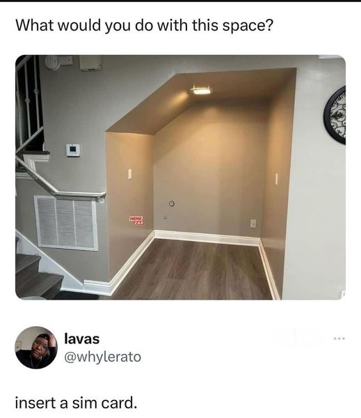 An empty, unfinished basement nook with sloped ceiling, wooden flooring, and visible electrical outlets, with overlaid text…