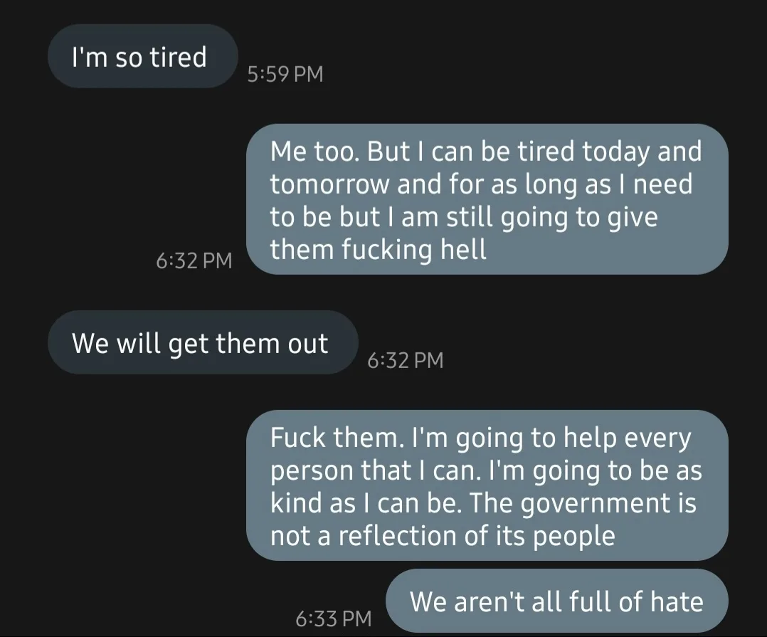A screenshot of a dark-themed text message conversation where one person says 'I'm so tired' and the other replies with an…