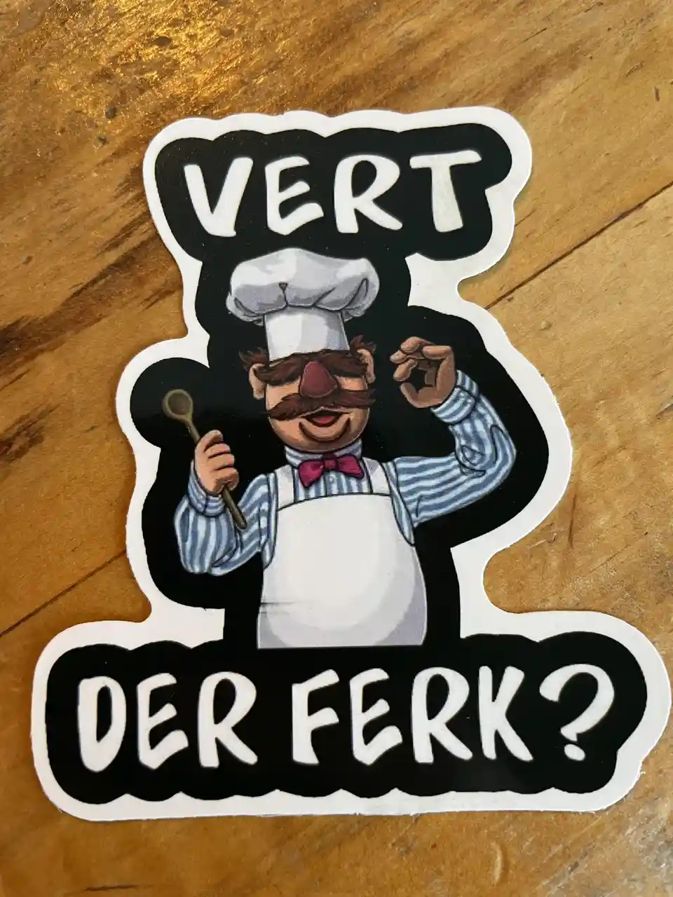 A sticker shows a cartoon chef with a mustache, chef's hat, and apron holding a spoon and making an 'okay' gesture. The text…