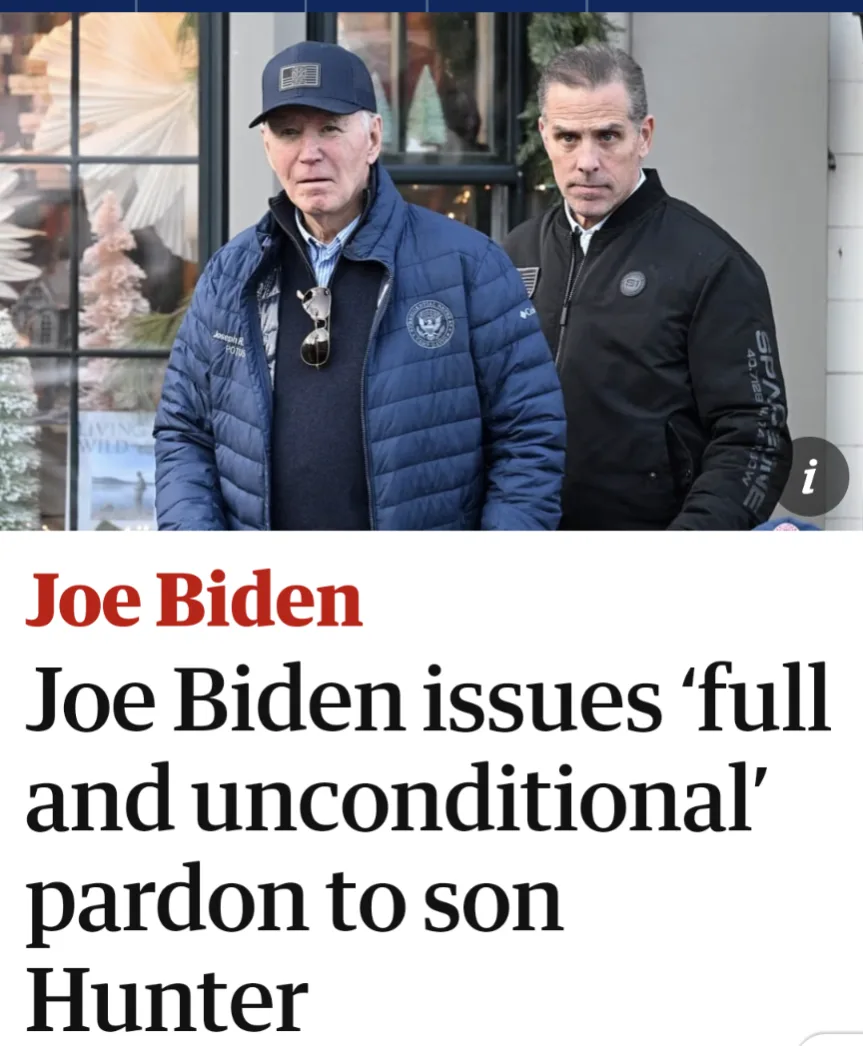 The image shows two men standing side by side outdoors. The man on the left, wearing a blue puffer jacket with a…