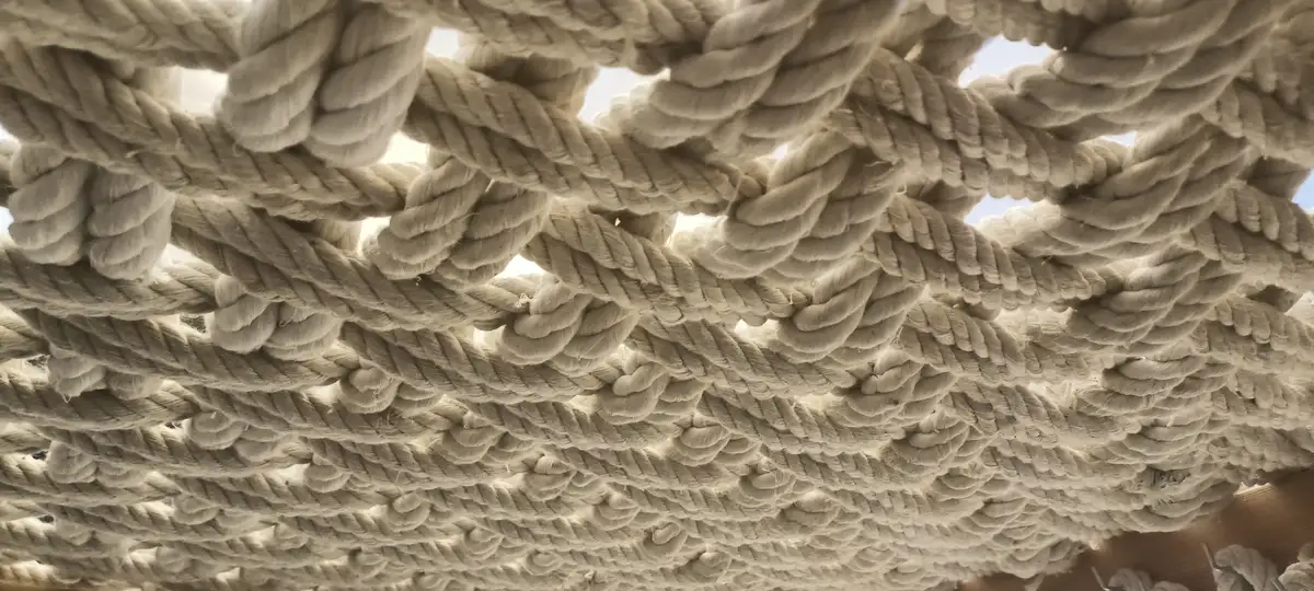 A beautifully woven table crafted from natural rope and wood