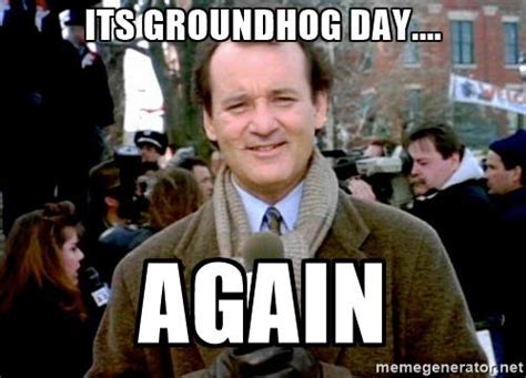 A still image of Bill Murray in a brown coat and scarf, smiling slightly while holding a microphone, from the movie…