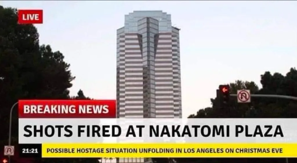 A news broadcast image shows a tall, modern skyscraper with horizontal stripes, identified as Nakatomi Plaza, under a clear…