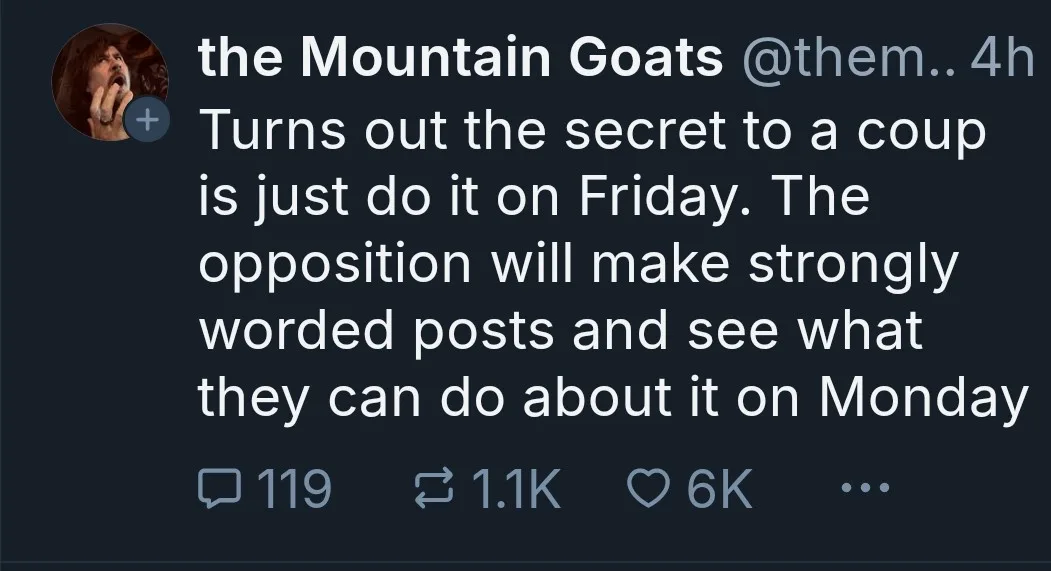 A screenshot of a tweet from the band 'the Mountain Goats' showing their profile picture and a dark-themed interface. The…