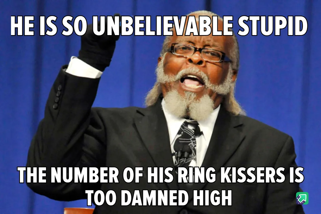 A man in a black suit and glasses, with a white beard and black gloves, raises his right hand while speaking passionately…