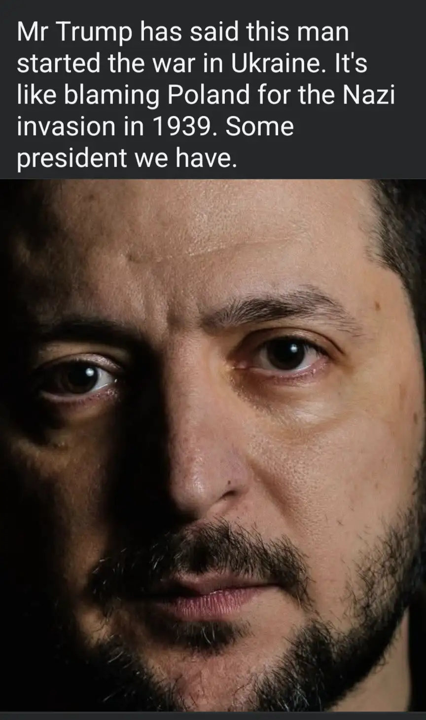 A close-up photo of a man with a beard and intense gaze, overlaid with white text criticizing Donald Trump for blaming…