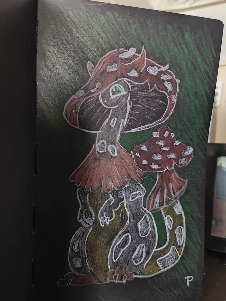 A hand-drawn illustration on dark paper shows a large, anthropomorphic mushroom with a smiling face, green eyes, and a red…