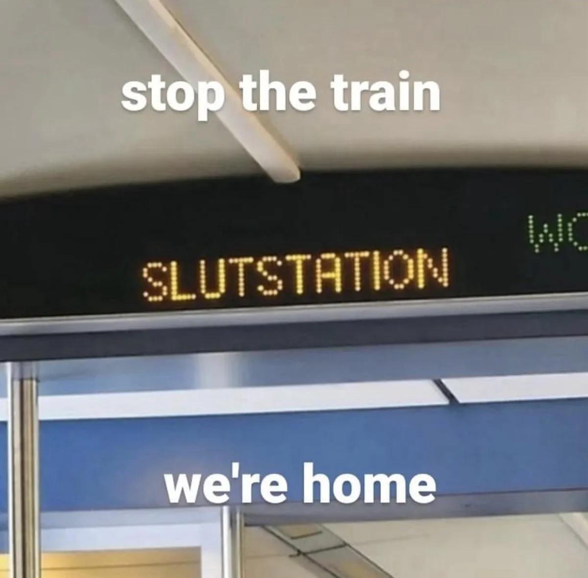 A close-up of a train station platform sign displaying the word 'SLUTSTATION' in yellow LED letters. White text overlays the…
