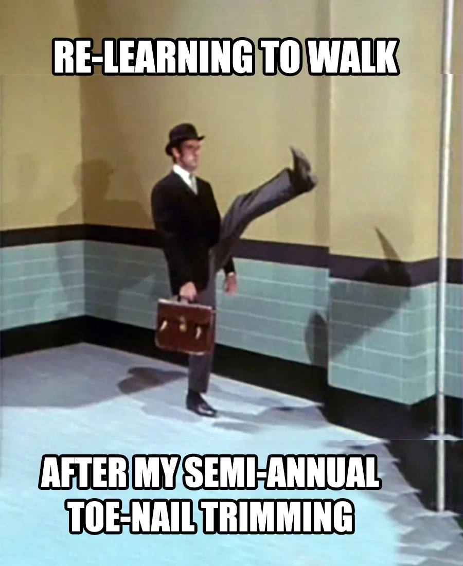 A man in a suit and hat, holding a briefcase, is shown mid-stride with one leg kicked high in the air, as if unsteady. The…