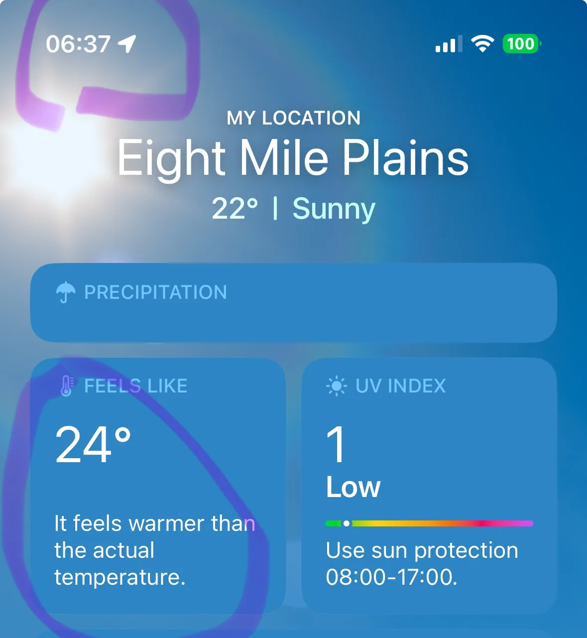 A smartphone weather app screenshot showing location 'Eight Mile Plains', actual temperature 22°, and 'feels like' 24° with…
