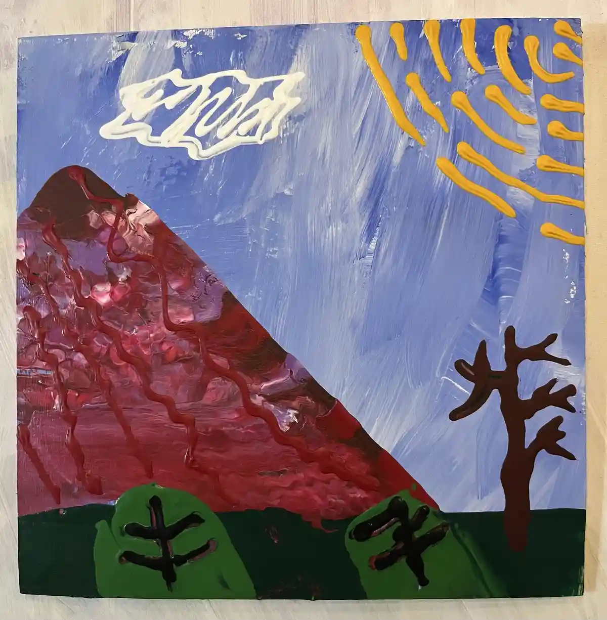 A textured painting depicts a stylized red mountain with wavy lines, a blue sky with a yellow sun, a bare tree, and green…