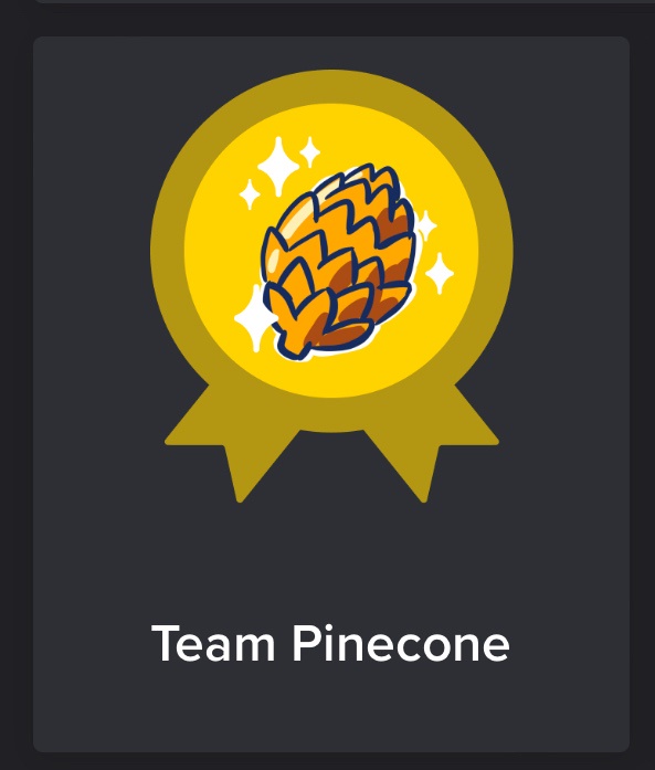 A digital badge with a yellow circular background and a gold ribbon, featuring a cartoon pinecone with sparkles. Below the…