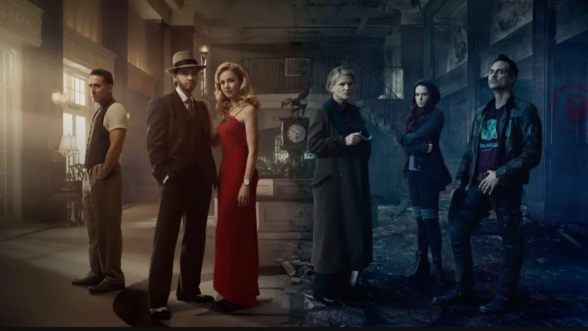 Six people stand in a split-image scene: a well-lit, elegant hallway on the left and a dark, ruined building on the right…