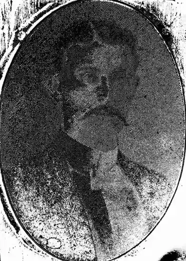 A heavily pixelated, black-and-white oval portrait of a person with indistinct facial features, framed by a worn border. The…