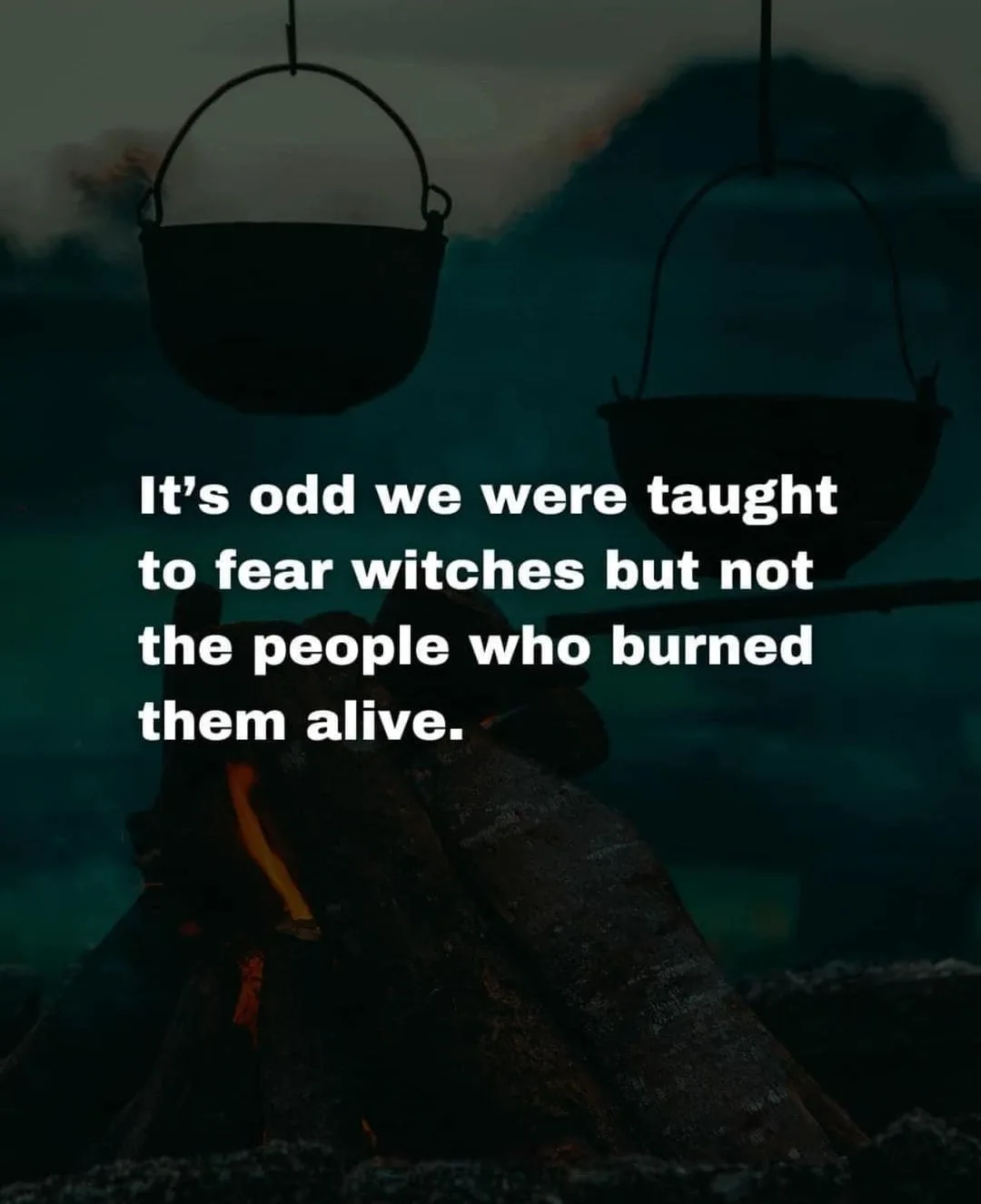 A dark, atmospheric image shows two black cauldrons hanging over a roaring campfire against a gloomy sky. White text…