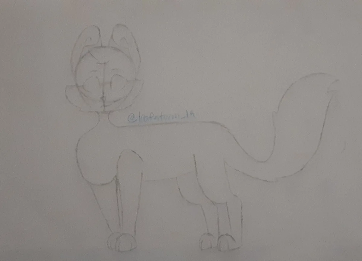 A simple pencil sketch of a cartoon-style cat with large ears, a smiling face, and a long tail, drawn on plain paper. The…