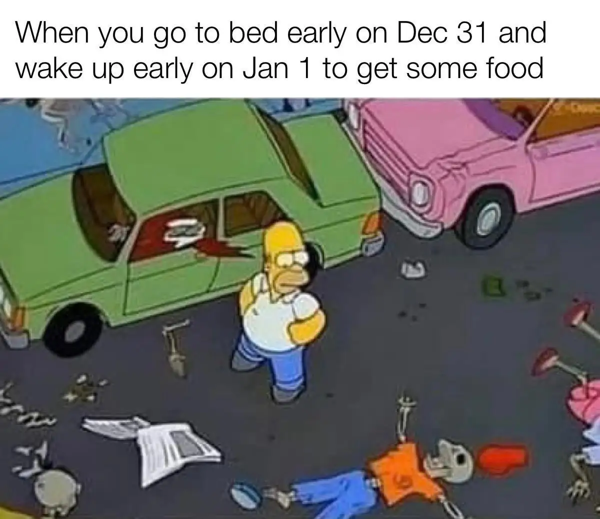 The image shows Homer Simpson standing in a parking lot surrounded by scattered debris, broken glass, and discarded items…