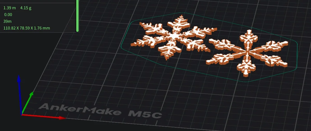 A 3D printer software interface displays two snowflake designs on a grid, with dimensions and weight stats in the top-left…