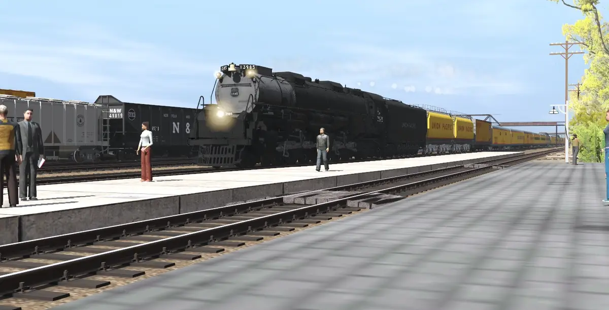 A screenshot from a train simulation game shows a black steam locomotive pulling Union Pacific freight cars at a station…