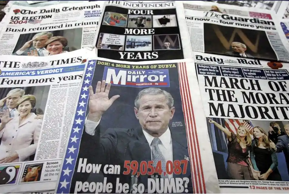 A collage of multiple UK newspaper front pages from November 2004, all reporting on George W. Bush's re-election victory…
