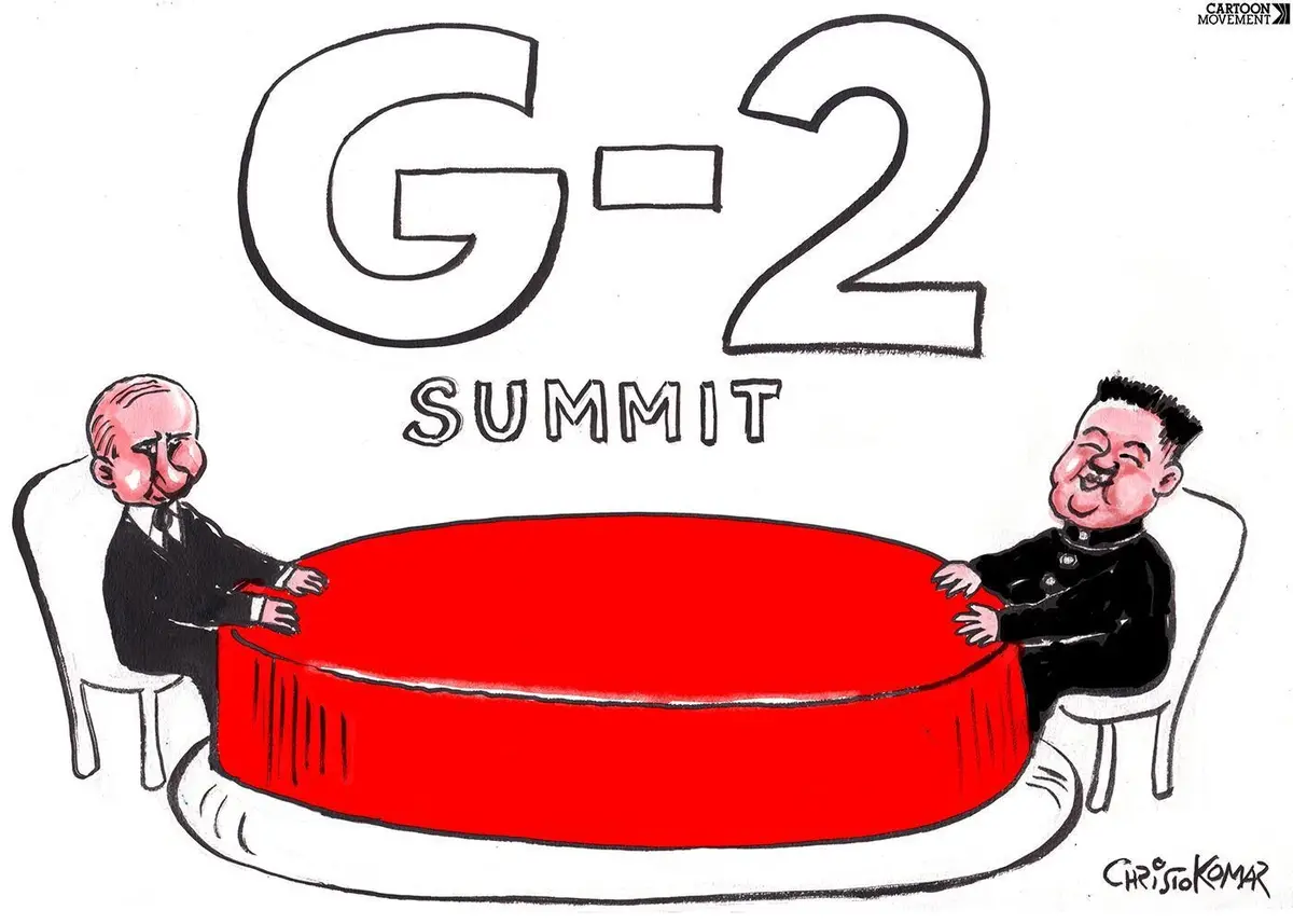 A cartoon depicts two caricatured world leaders, Vladimir Putin and Kim Jong-un, sitting opposite each other at a large…
