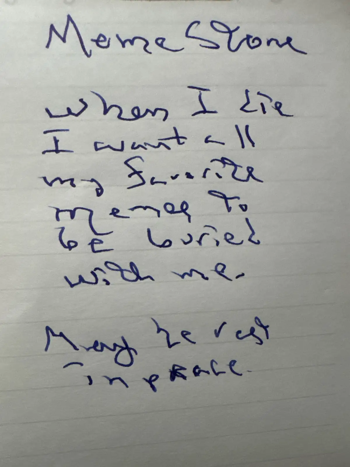 Handwritten text on lined paper mimicking a tombstone, titled 'Meme Stone,' humorously stating the desire to be buried with…