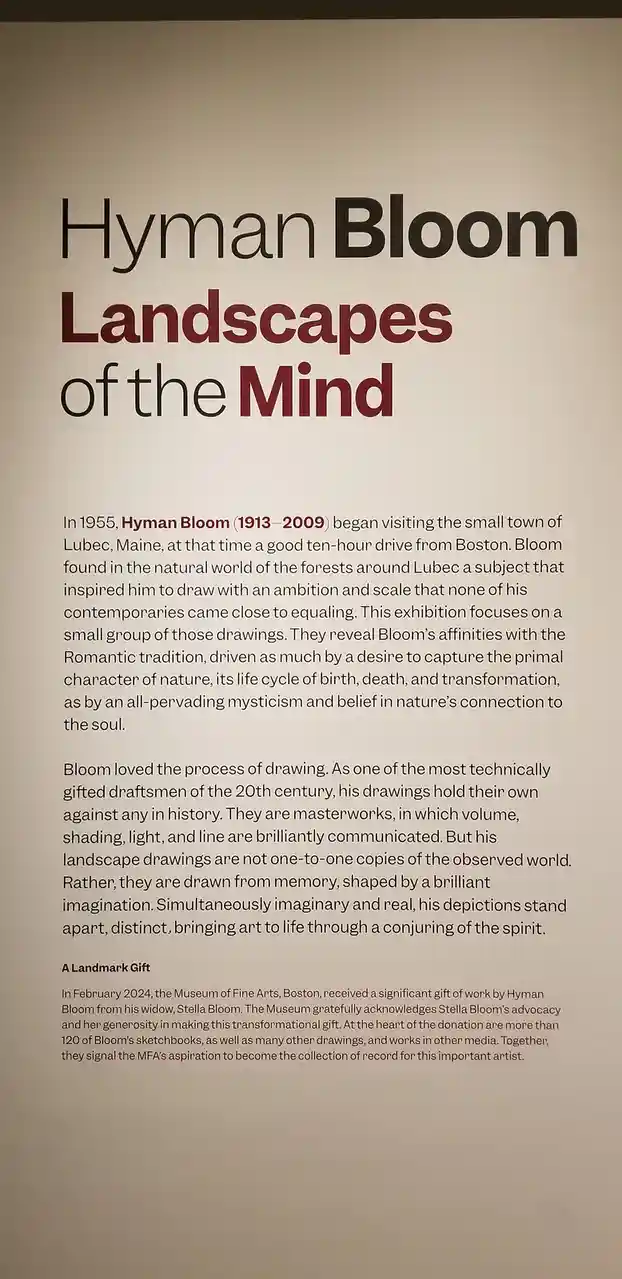 A museum exhibit sign for 'Hyman Bloom: Landscapes of the Mind' describes the artist's work, noting his 1955 move to Lubeck…