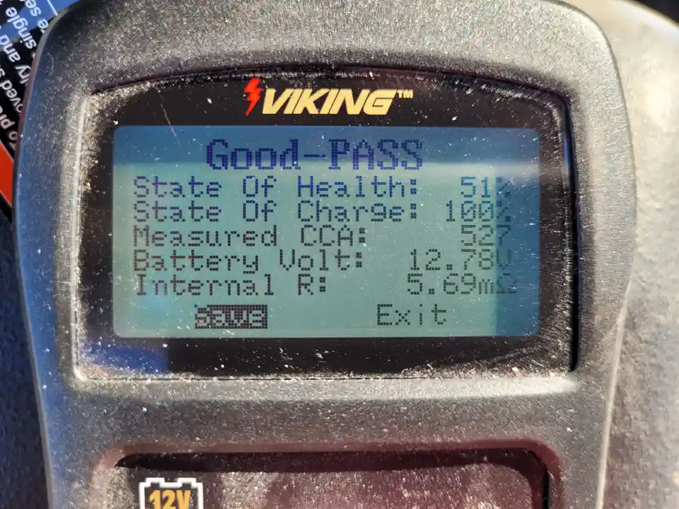 A close-up of a Viking brand battery tester's screen showing a 'Good-PASS' result with detailed metrics: 51% state of…