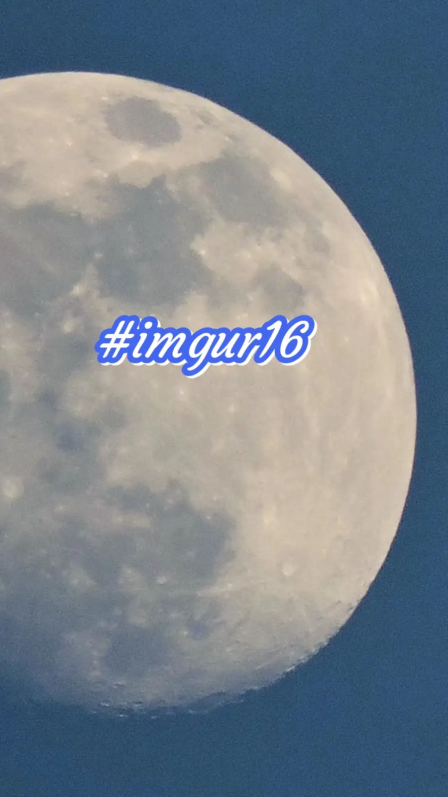A close-up photograph of the moon against a dark blue sky, with the text '#imgur16' overlaid in a stylized blue font with a…