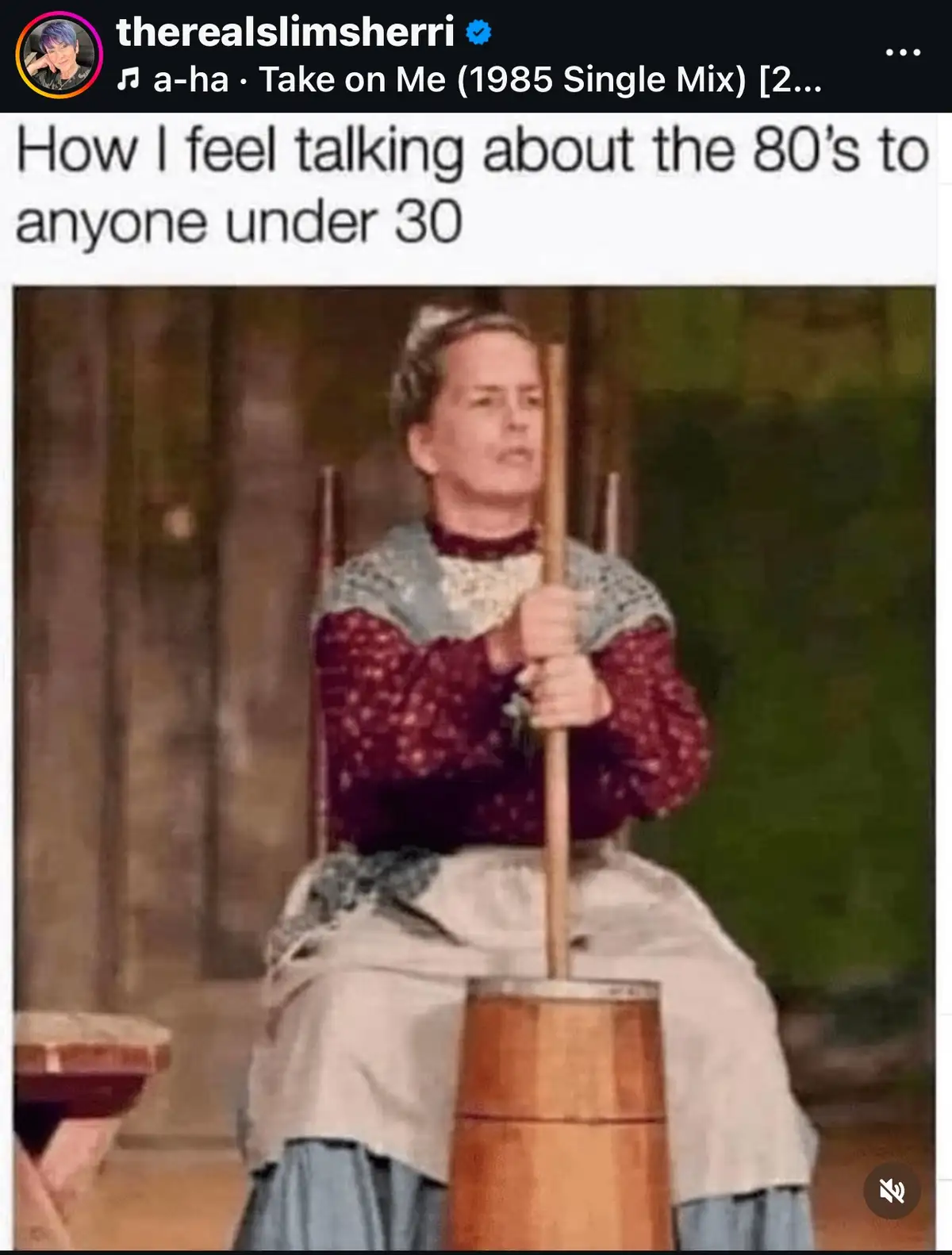 A woman in period clothing, seated and gripping a wooden pole stuck in a barrel, looks intensely frustrated. The overlaid…