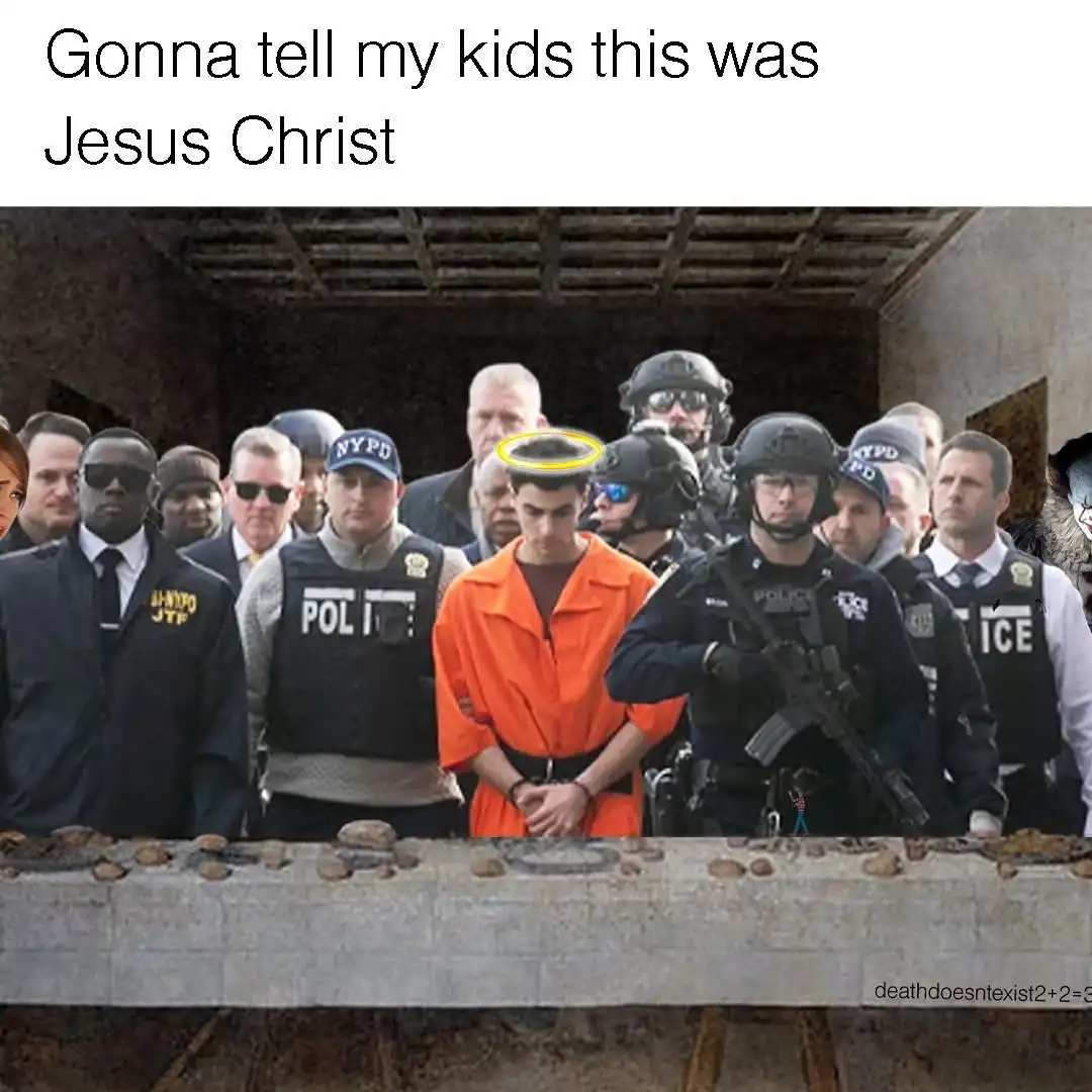 A man in an orange prison jumpsuit stands with hands cuffed in front of him, surrounded by numerous police officers in…