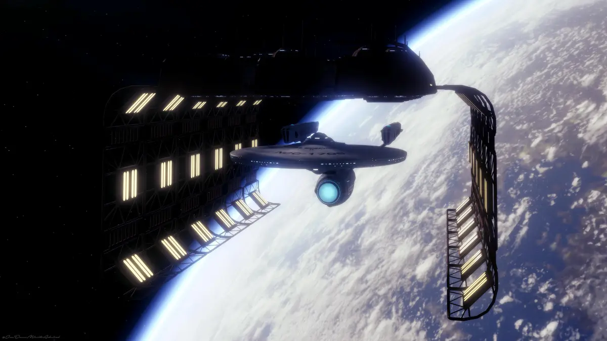 A starship labeled 'U.S.S. ENDEAVOUR NCC-1701' is shown docked inside a large, illuminated space station structure, with a…