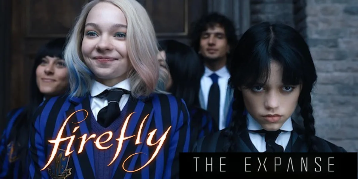A still from the TV show 'Wednesday' shows two young women in school uniforms; the one on the left has blonde hair with blue…