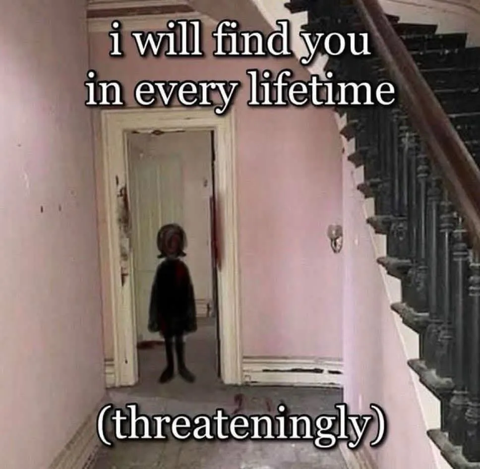 A blurry image of a small child in a dark dress standing in a doorway of a pink hallway next to a staircase. White text…