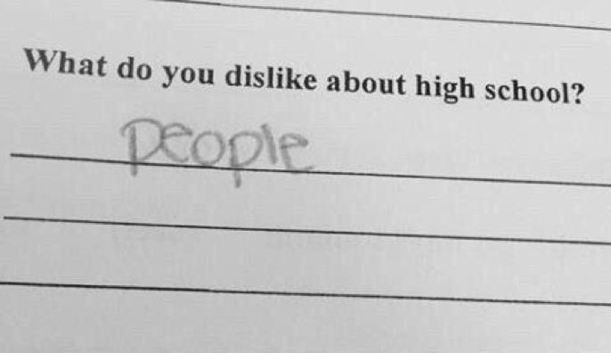 A close-up of a lined worksheet with the printed question 'What do you dislike about high school?' followed by the…