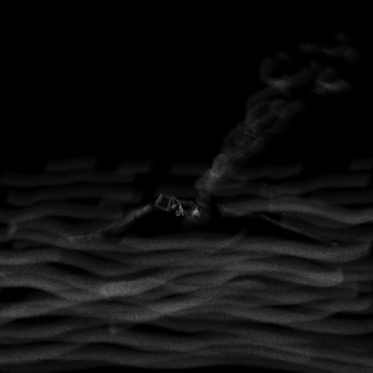 A grainy, black-and-white image shows a dark, shadowy hand reaching down from the top right corner toward a small, glowing…