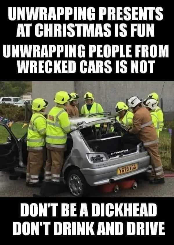 A group of emergency responders in yellow and brown uniforms are shown extricating a person from a severely damaged silver…