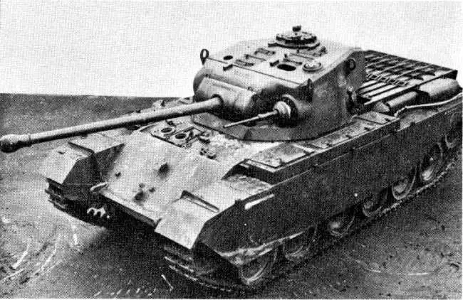 A black-and-white photograph shows a heavy tank with a long barrel cannon, sloped armor, and a distinctive hull design…