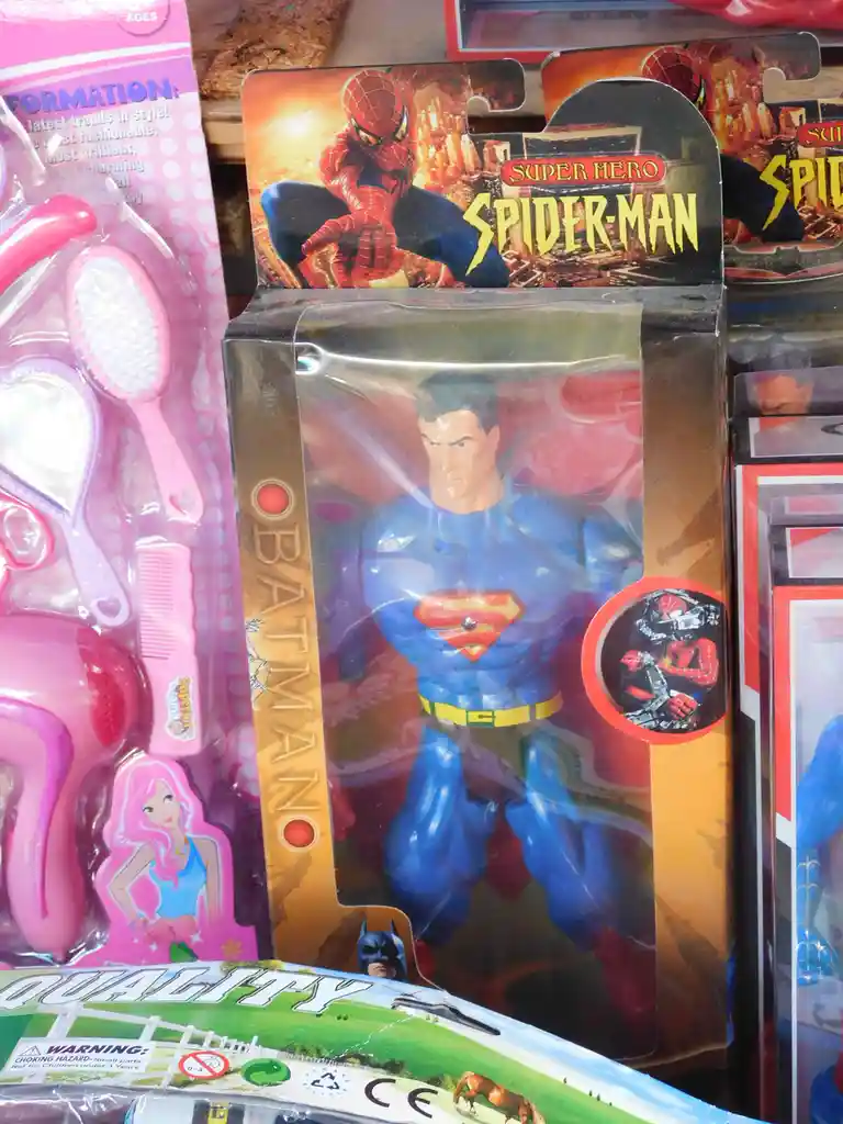 A toy package labeled 'SUPER HERO SPIDER-MAN' contains a figure dressed as Superman, not Spider-Man, creating a humorous…