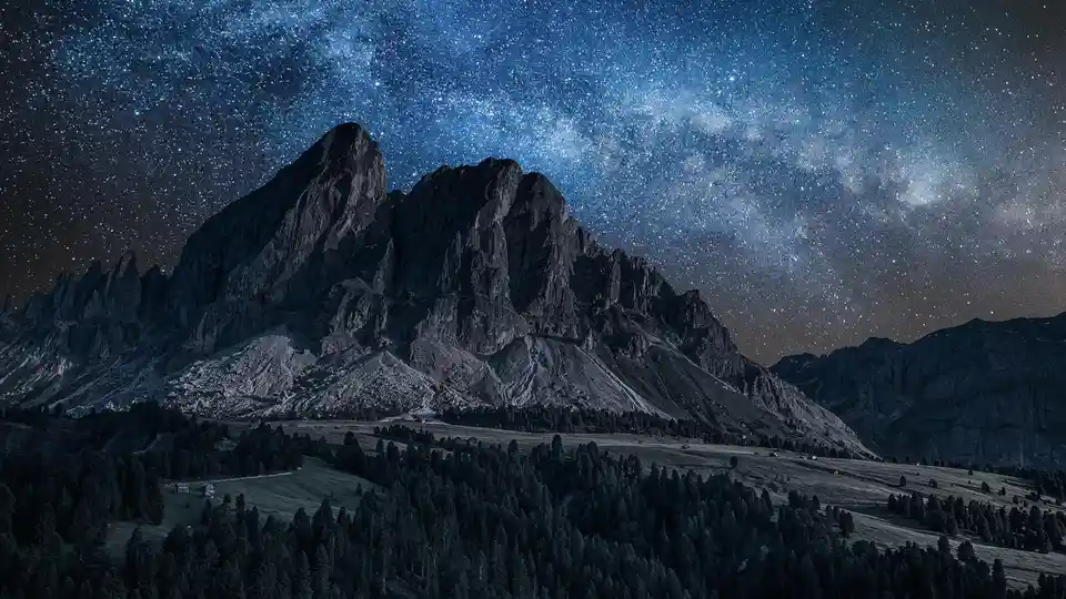 In the soft Milky Way glow, a majestic Dolomites' peak rises above the WÃÂ¼rzjoch pass in Italy's South Tyrol. Experience…