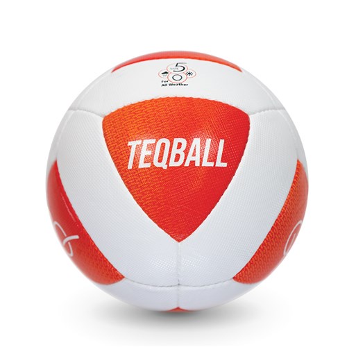 A white and orange teqball, a sport-specific ball with 'TEQBALL' printed in white on a red panel, is shown against a plain…