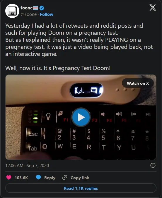 A screenshot of a tweet by user 'foone' showing a video where a pregnancy test is placed on top of a keyboard, with the…