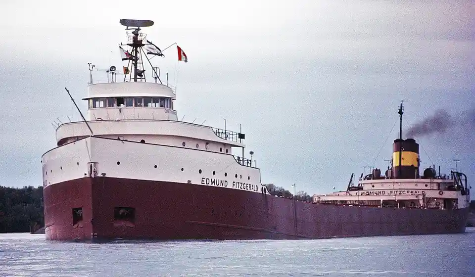 A large ship named 'EDMUND FITZGERALD' is shown in two mirrored, side-by-side views on water, with the text 'edmund…