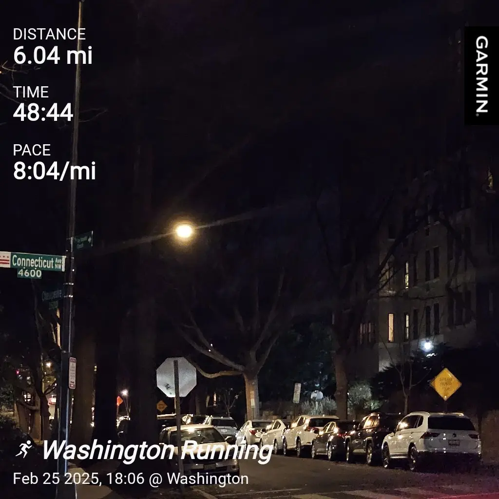 A night-time street view from a Garmin running app showing a 6.04-mile run completed in 48:44 at a pace of 8:04/mi, with the…